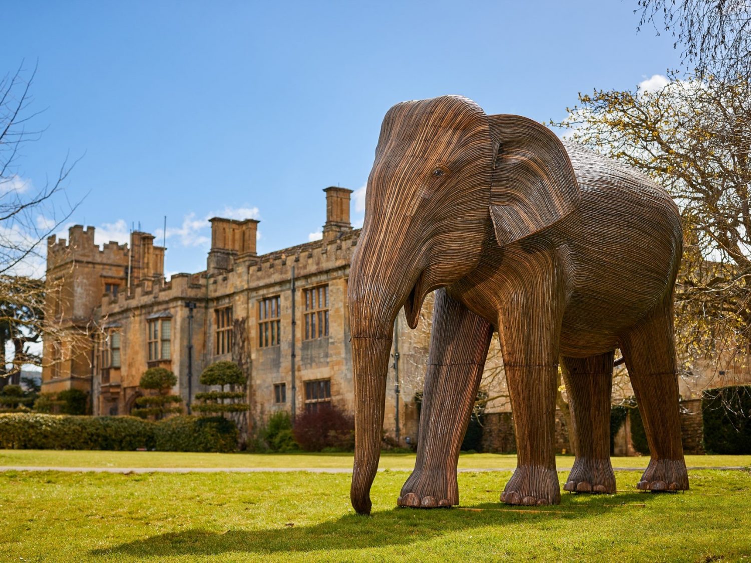 Elephant sculpture in front of castle