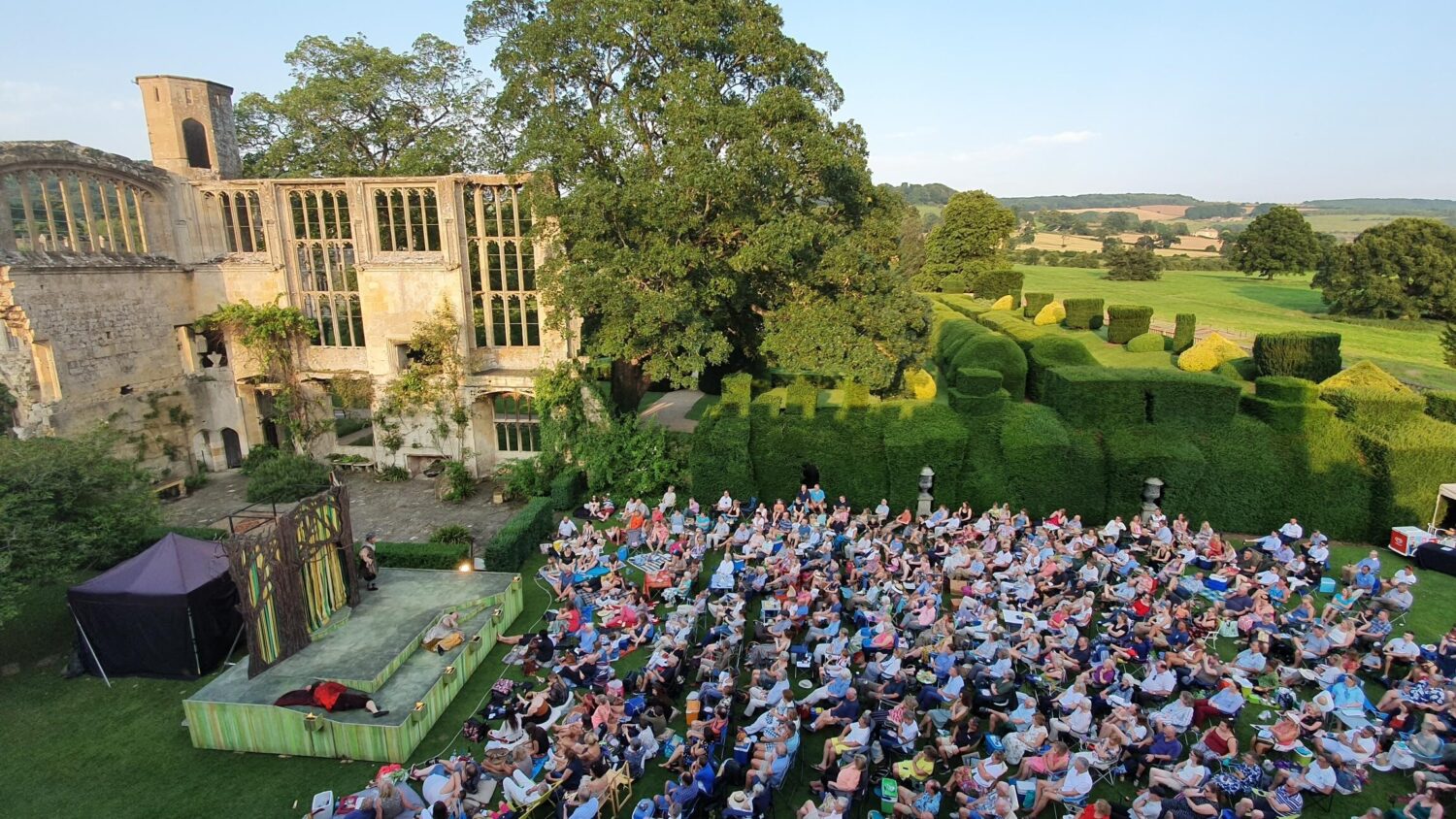 An outdoor theatre performance at Sudeley Castle