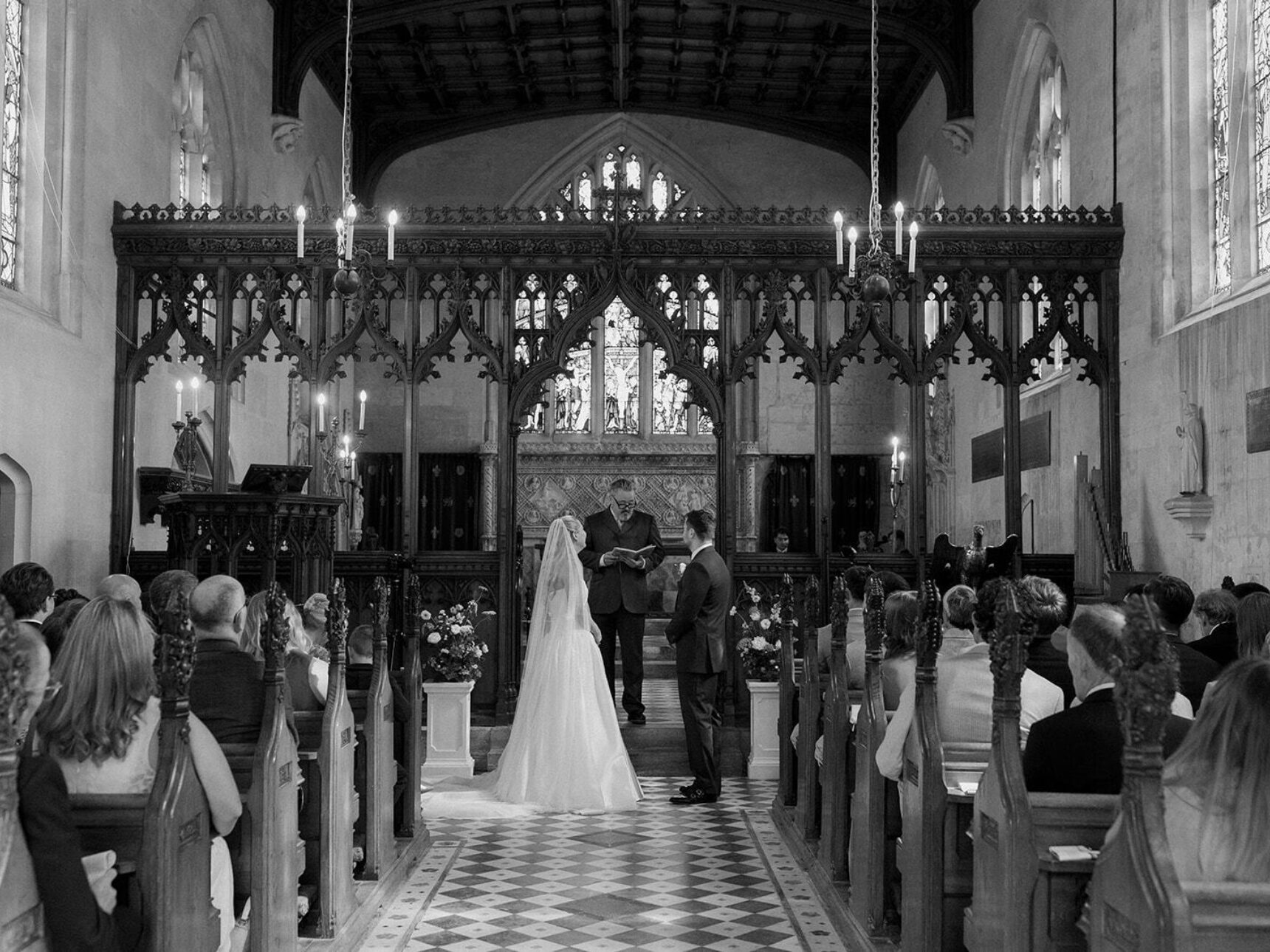 A black and white photo of a wedding ceremony in our chapel.