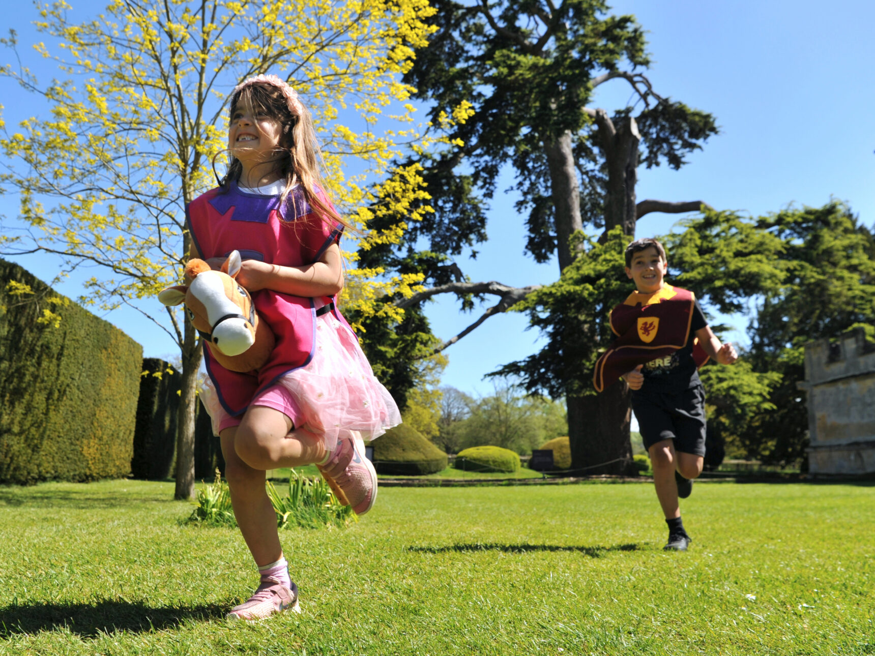 Children playing near Sudeley's Cedar of Lebanon tree