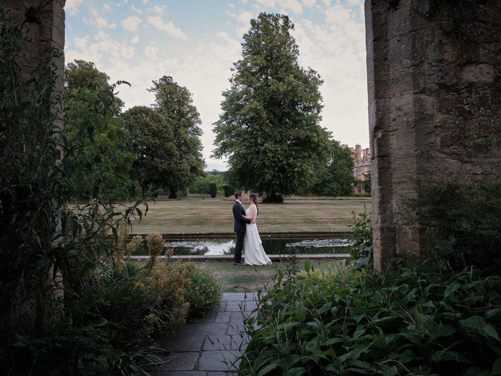 Tithe Barn stone archways are a wonderful natural framework to your couple portraits.